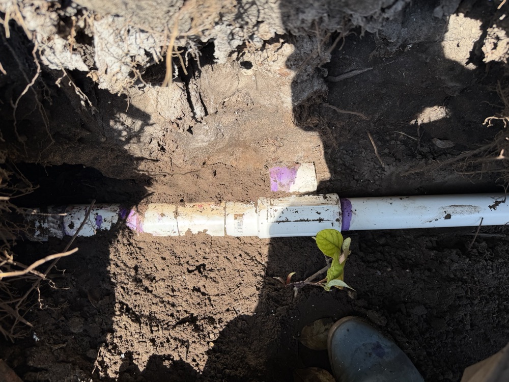 PVC mainline repair with a new coupling in an open trench