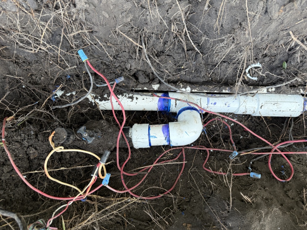 Replaced irrigation valve and elbow in an open trench with new wiring
